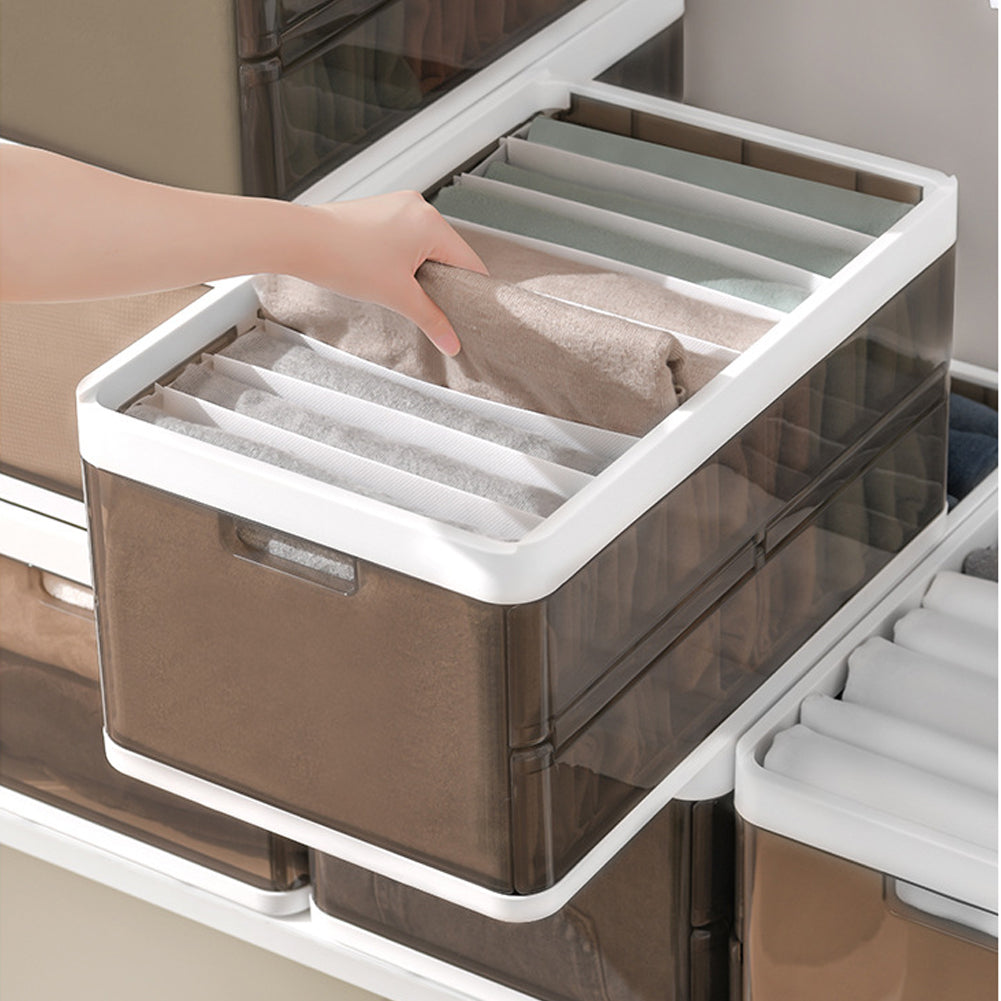 Transparent clothes organizer drawer with white lid, fabric compartments in dividers